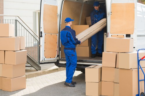 Professional packing team organizing boxes for a local home move