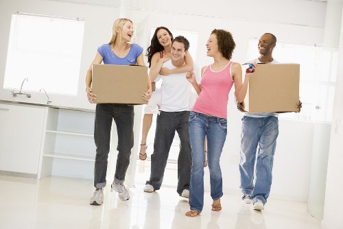 Local removals team handling furniture in a Movingfurniture home
