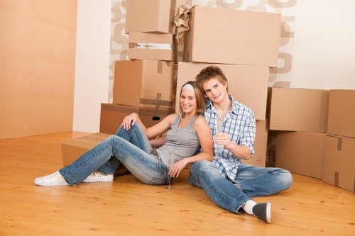 Removal team handling furniture in a local Movingfurniture street