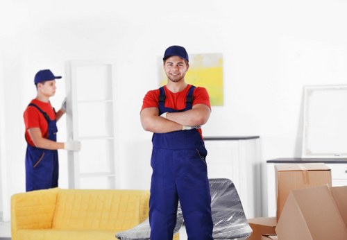 Removal team handling furniture move in a local home setting