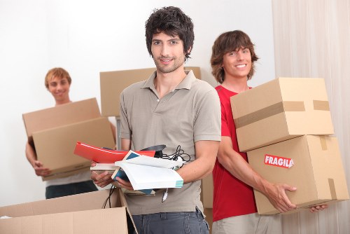 Office furniture being relocated by a local removal company