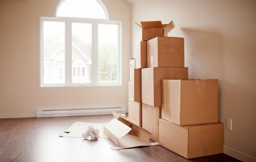 Local moving crew preparing furniture and packed boxes for transport