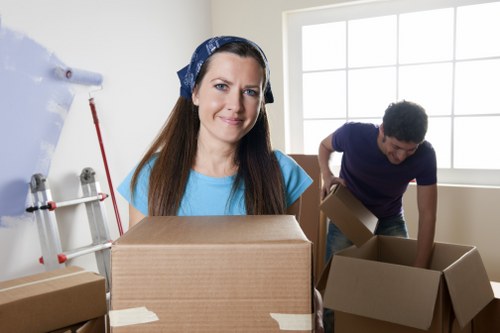 Careful loading of bulky items into a removals van