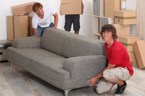 Furniture transport team planning a house move with careful loading and access checks