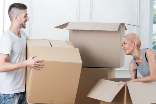 Professional team loading bulky furniture for local transport