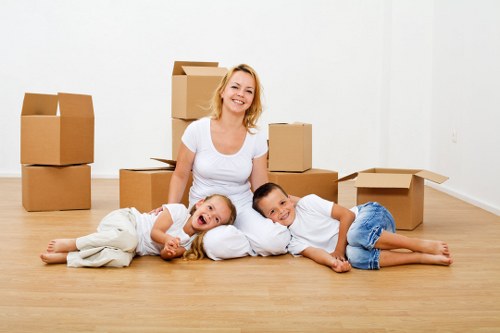 Commercial furniture movers arranging office desks and equipment