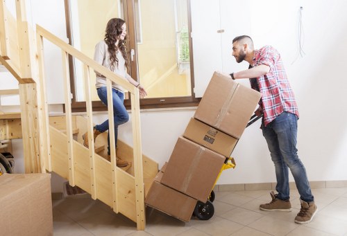Supervisor investigating damage reports for a furniture relocation service