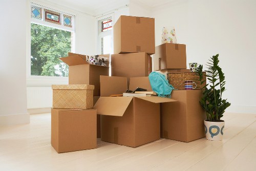 Local moving team planning a house move with stairs and access considerations