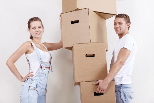 Commercial furniture and office items being prepared for truck loading
